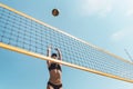 Teenage girl playing beach volleyball. Beach volleyball championship. woman reaches for the ball. throwing a yellow Royalty Free Stock Photo