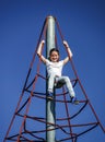 Teenage girl playing on child playground Royalty Free Stock Photo