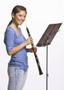 Teenage girl playing clarinet Royalty Free Stock Photo