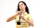 Teenage girl playing clarinet Royalty Free Stock Photo