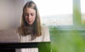 Teenage girl playing electronic musical instrument