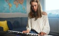 Teenage girl playing electronic piano