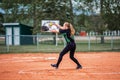 Teenage girl playing fastball