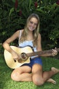 Teenage girl playing guitar Royalty Free Stock Photo