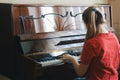 Teenage girl playing the piano at home Royalty Free Stock Photo