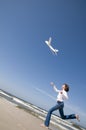 Teenage girl playing with plane model