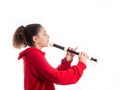 Teenage girl playing a recorder or flute Royalty Free Stock Photo