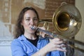 Teenage girl playing the trombone