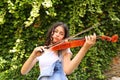 Teenage girl playing violin outdoor Royalty Free Stock Photo