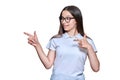 Teenage girl pointing fingers to the side at space for text, on white isolated background Royalty Free Stock Photo