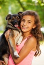 Teenage girl portrait in hugging little dog Royalty Free Stock Photo