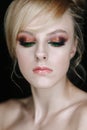 Teenage girl portrait looking down. Beauty Make-up with glitter brown and green eye shadows Royalty Free Stock Photo