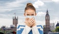 Teenage girl in protective medical mask in london