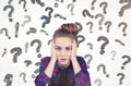 Teenage girl and question marks Royalty Free Stock Photo