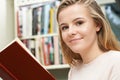 Teenage Girl Reading Book At Home Royalty Free Stock Photo