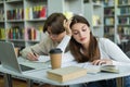 teenage girl reading book near friend