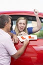 Teenage Girl Receiving Her Learner Plates