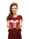 Teenage girl in red dress with gift box Royalty Free Stock Photo