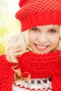 Teenage girl in red hat and scarf Royalty Free Stock Photo