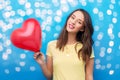 teenage girl with red heart-shaped balloon Royalty Free Stock Photo