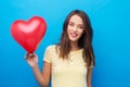 Teenage girl with red heart-shaped balloon Royalty Free Stock Photo