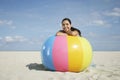 Teenage Girl Relaxing On Colorful Beach Ball