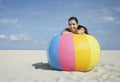 Teenage Girl Relaxing On Large Colorful Beach Ball
