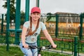 Teenage girl relaxing on a stadium.The girl way of life by bike.