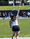 Teenage girl releasing the javelin during competition