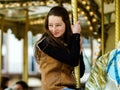 Teenage girl riding on carusel in Saverne, Royalty Free Stock Photo