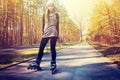 Teenage girl on roller skates at summer. Royalty Free Stock Photo