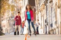 Teenage girl rollerblading around the cones