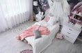 Teenage girl`s room interior with bed and floral wallpaper. Idea for stylish design Royalty Free Stock Photo