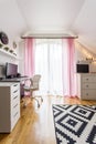 Teenage girl`s room with white funiture