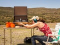 Teenage girl shooting a rifle