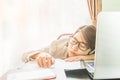 Teenage girl short hair sleep on desk after working