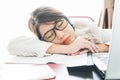 Teenage girl short hair sleep on desk after working