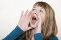Teenage Girl Shouting With Hands Cupped Around Mouth