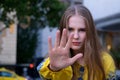 Teenage girl showing stop sign with hand. Soft selective focus. Stop teen bullying concept Royalty Free Stock Photo