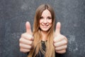 Teenage girl showing thumbs up Royalty Free Stock Photo