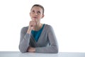 Teenage girl sitting against white background Royalty Free Stock Photo