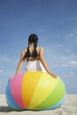 Teenage Girl Sitting On Beach Ball Royalty Free Stock Photo