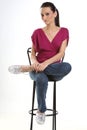 Teenage girl sitting on a chair Royalty Free Stock Photo