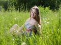 Teenage girl sitting in the grass