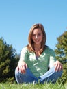 Teenage girl sitting in grass Royalty Free Stock Photo