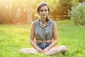 Teenage girl sitting on a meadow Royalty Free Stock Photo