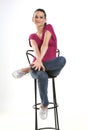 Teenage girl sitting on studio chair Royalty Free Stock Photo