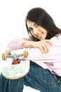 Teenage girl with a skate board Royalty Free Stock Photo