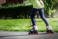 Teenage girl is skating on roller blades in the park Royalty Free Stock Photo