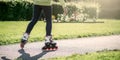 Teenage girl is skating on roller blades in the park Royalty Free Stock Photo